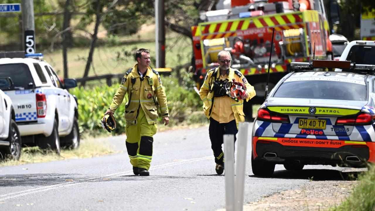 NSW firefighters at the scene of a house fire where a colleague died.
