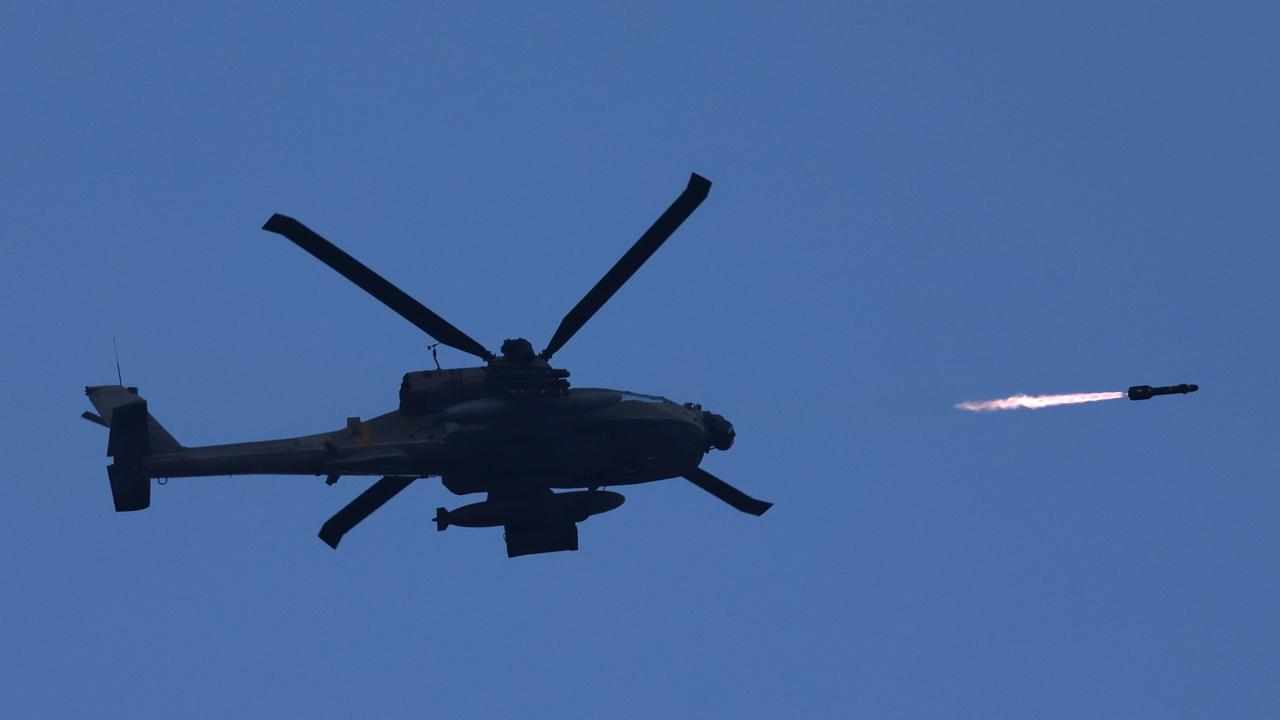 An Israeli military helicopter fires a missile