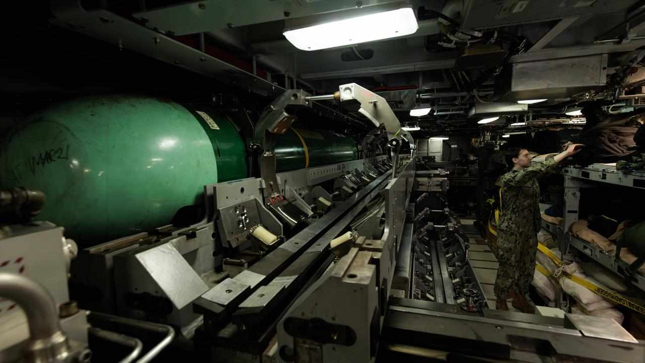 Crew member inside a Virginia-class submarine.
