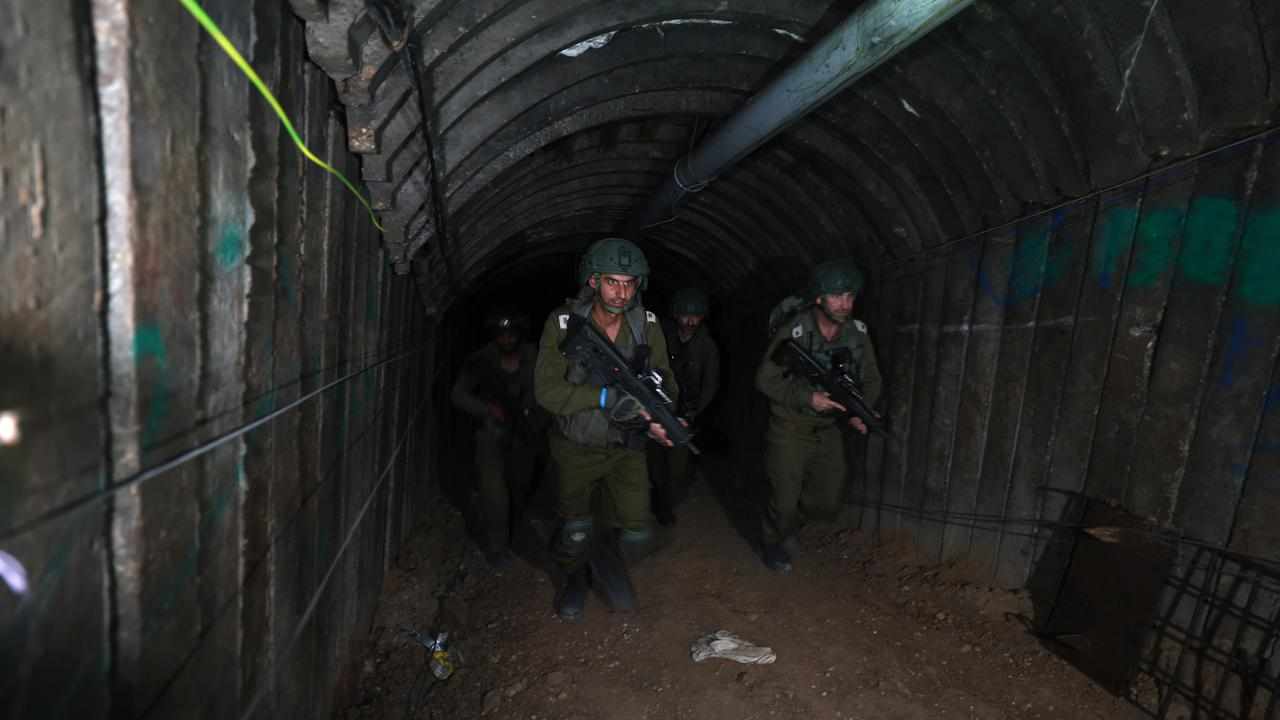 Israeli soldiers inside a tunnel near the Gaza border