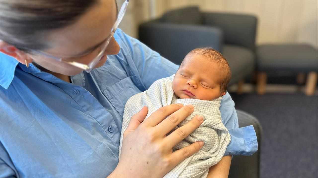 Newborn Henry Bryant, being held by his mother Kirsty