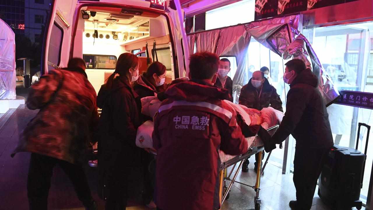 A person injured in an earthquake is taken to hospital in Gansu.