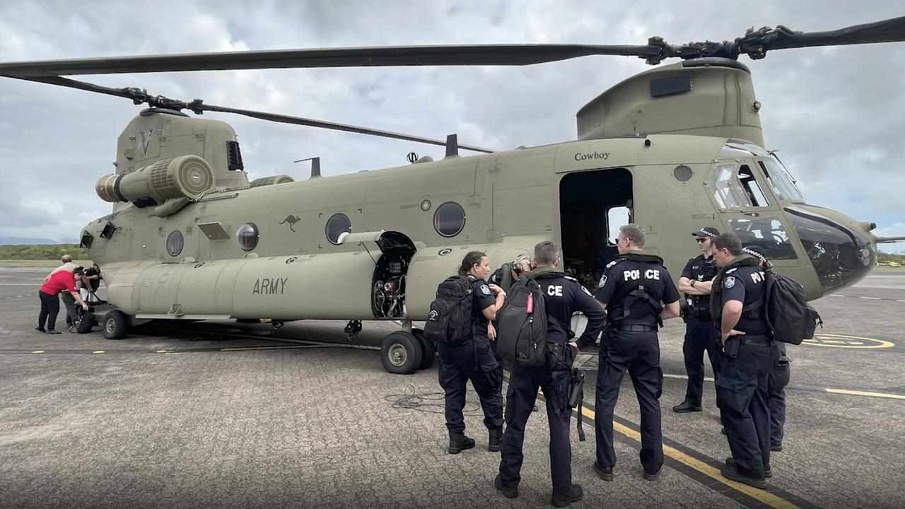 Officers about to board an ADF Chinook to assist recovery efforts