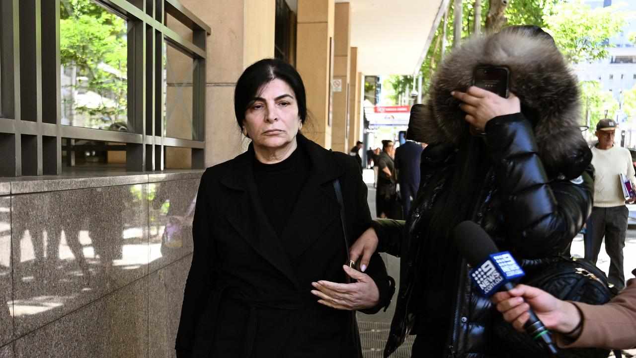 Madlin Enwiya (left) leaves the Melbourne Magistrates’ Court