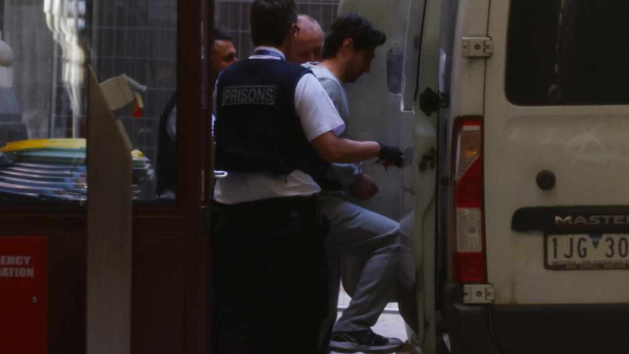Luay Sako is escorted to a prison van at the Supreme Court of Victoria