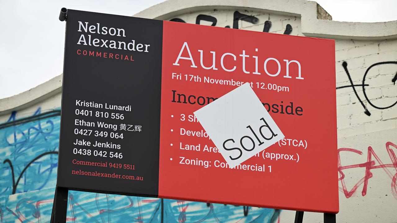 A real estate sign advertising an auction