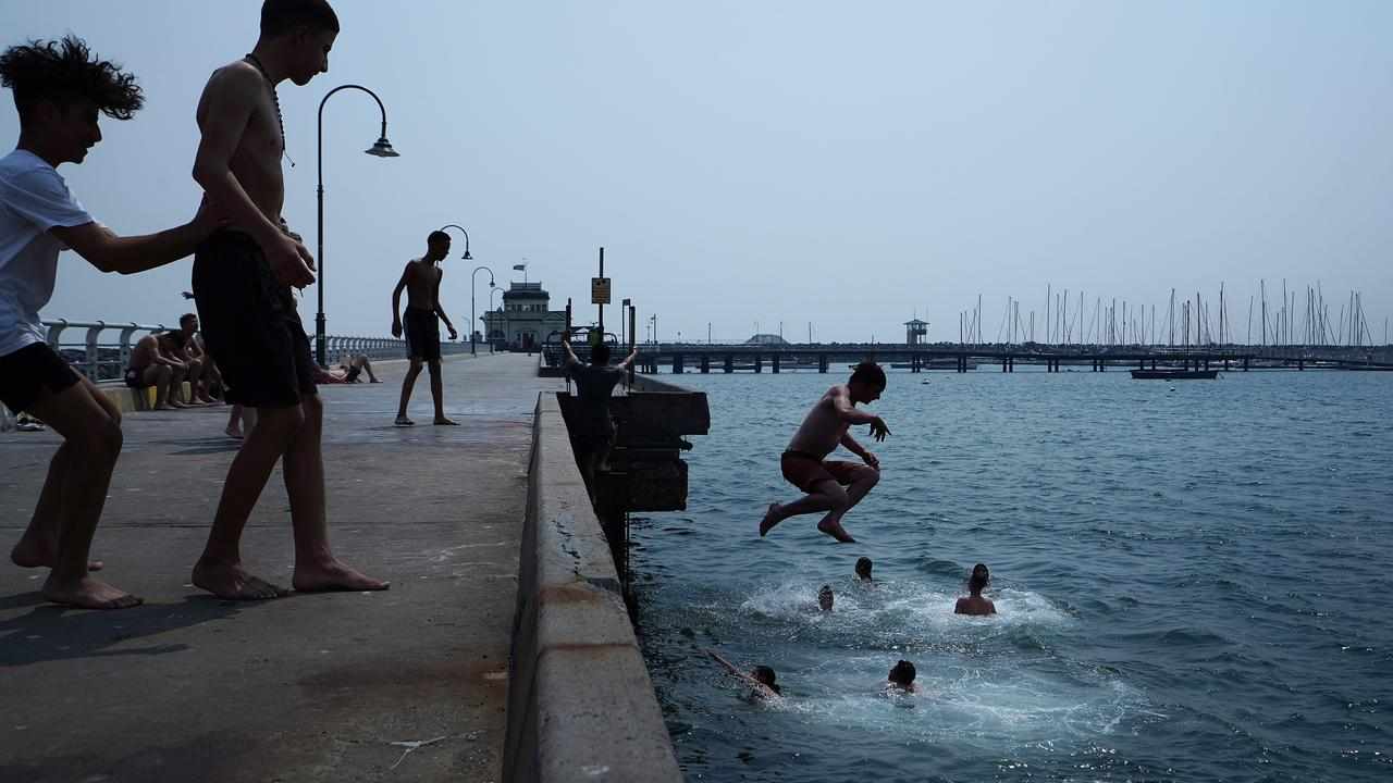 Teenagers jump off the St Kilda pier