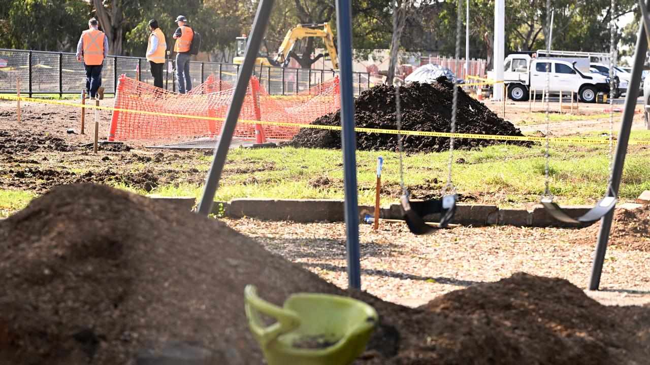 Workers near where asbestos has been found at Hosken Reserve