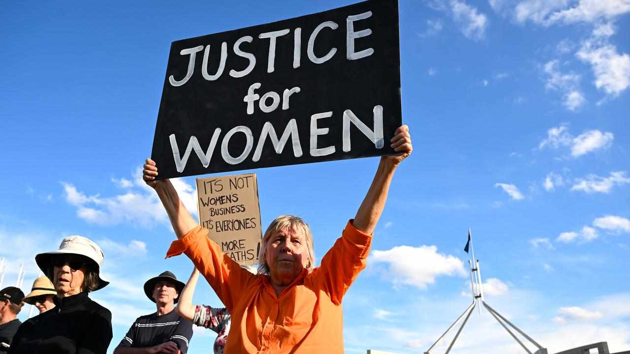 A woman at a rally to a call for action to end violence against women