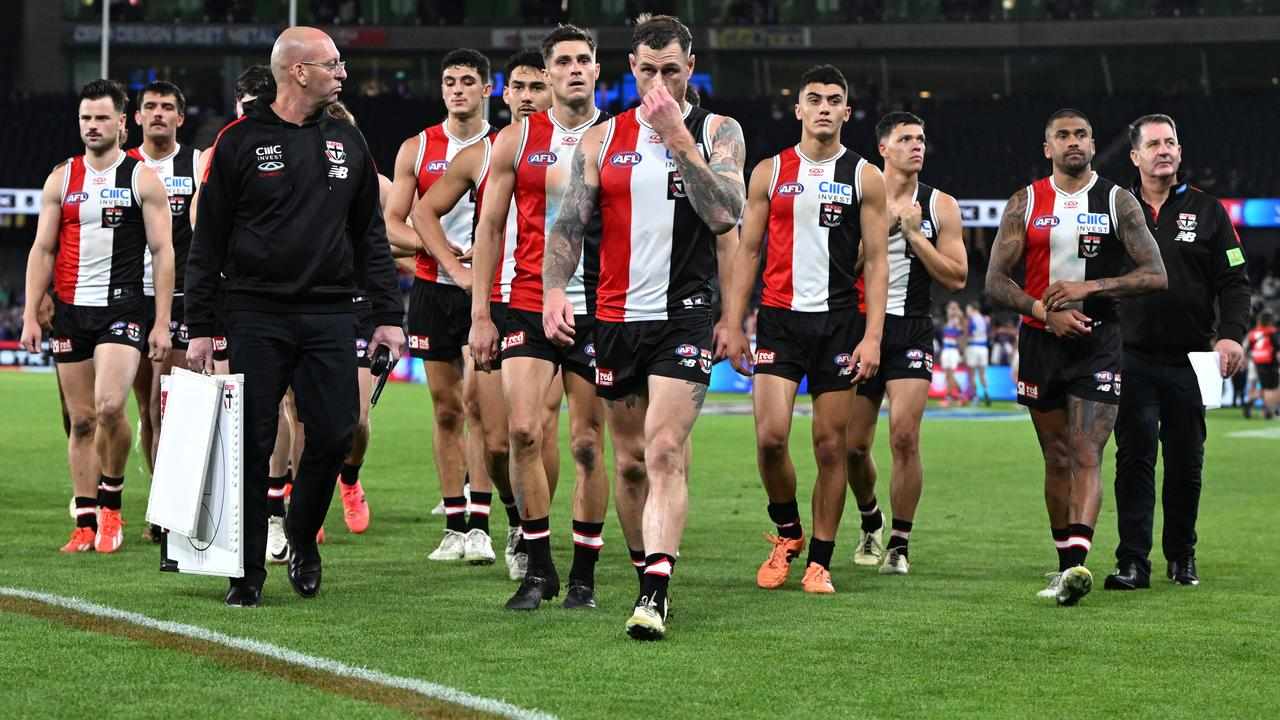 St Kilda players leave the field.