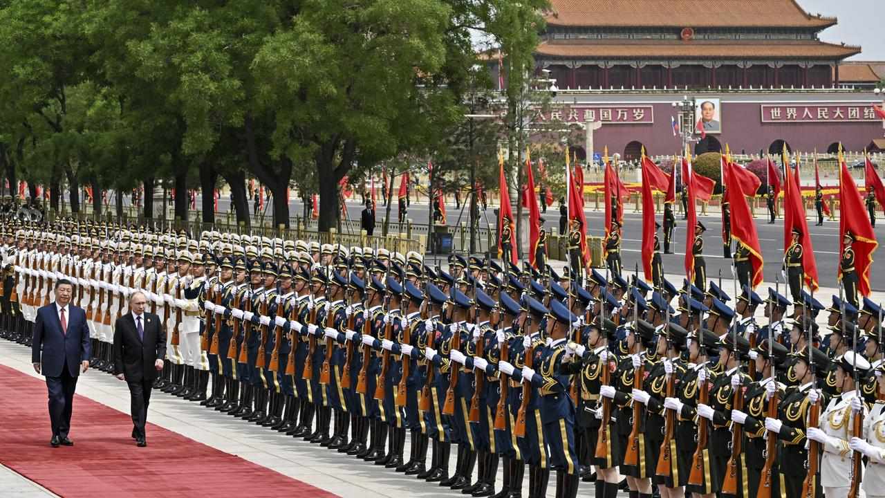 Xi Jinping and Valdimir Putin review the honour guard in Beijing