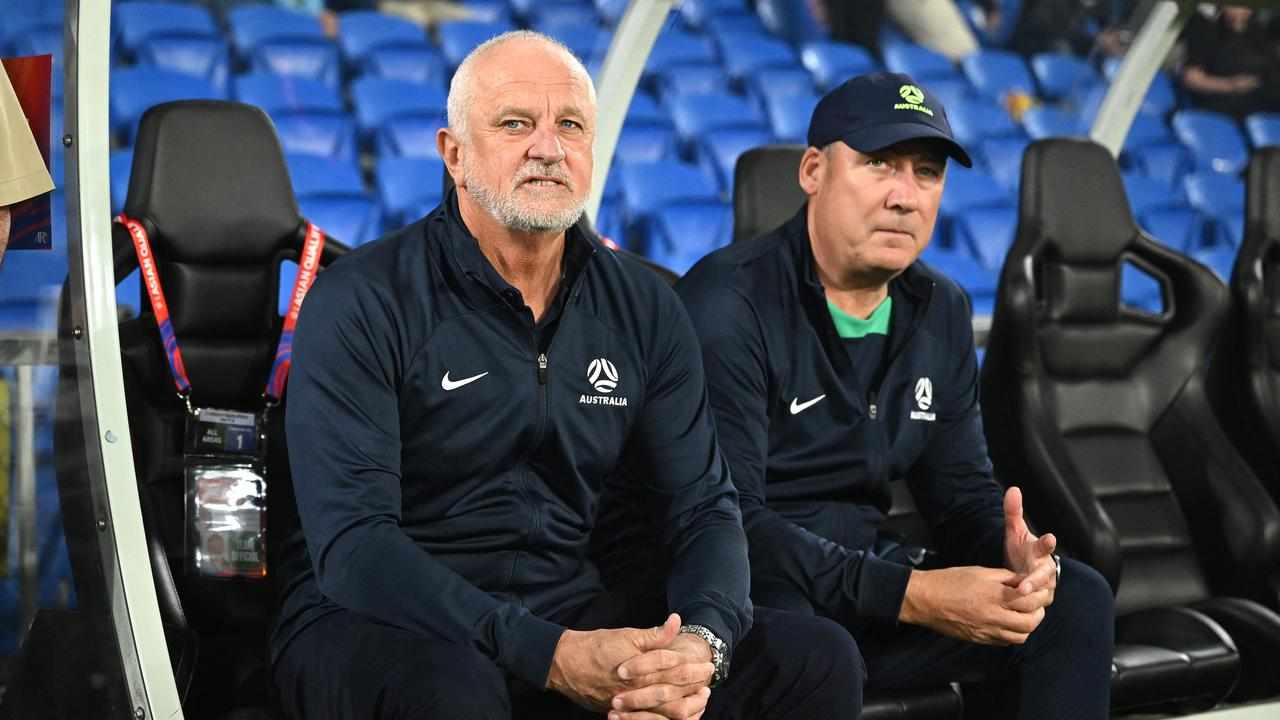 Graham Arnold (left) and  assistant coach Rene Meulensteen.