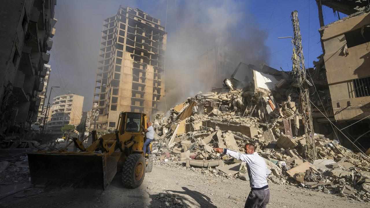 A bulldozer at the site of an Israeli air strike in Dahiyeh, Beirut